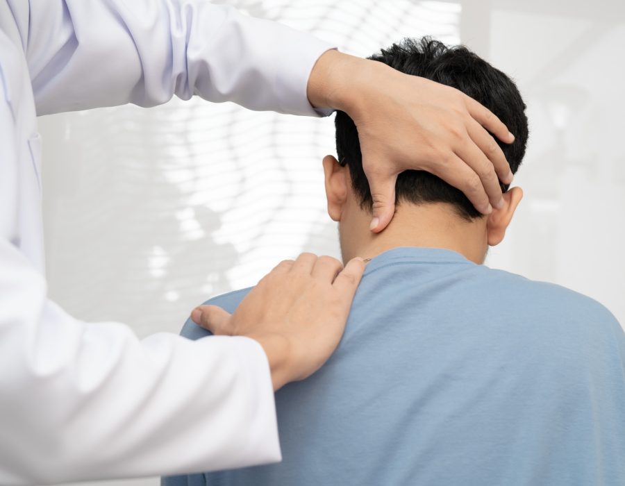 Physical therapy, Asian therapist doctor treat perform pain young man in hospital.